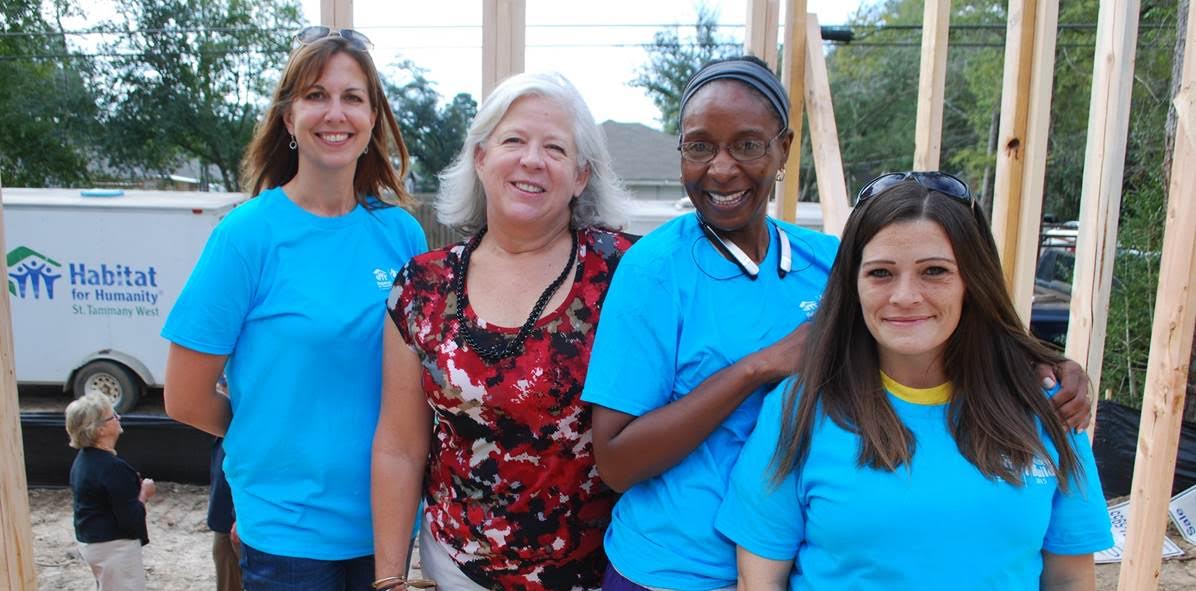 PHOTO CAPTION (From left to right): Habitat for Humanity St. Tammany West Development Director Jennifer Messina, Chevron representative Marcia Houghton and future Habitat Homebuyers Danielle Howard and Sabrina Stallworth raise the first walls on homes to be completed by the end of Spring 2016.